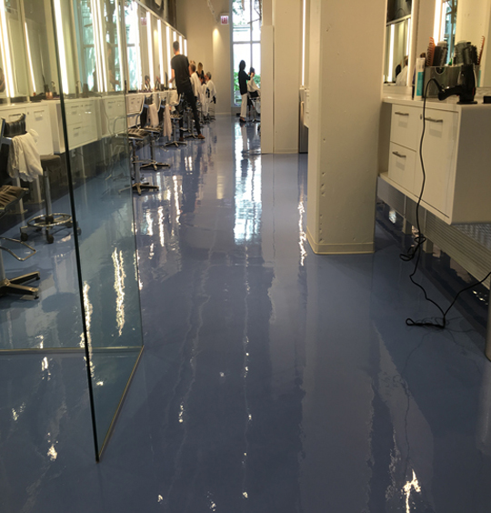 Blue high-gloss epoxy floor in a salon